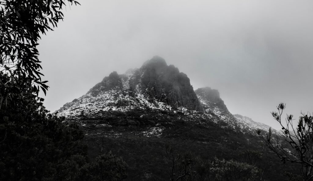 Misty mountain peaks representative of the Rwenzori Mountains trekking terrain, Uganda