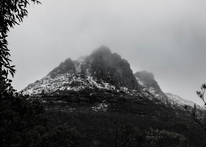 Misty mountain peaks representative of the Rwenzori Mountains trekking terrain, Uganda